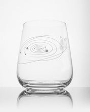 A SECONDS: Voyage to the Unknown Wine Glass with an image of a solar system on it, made by Cognitive Surplus.